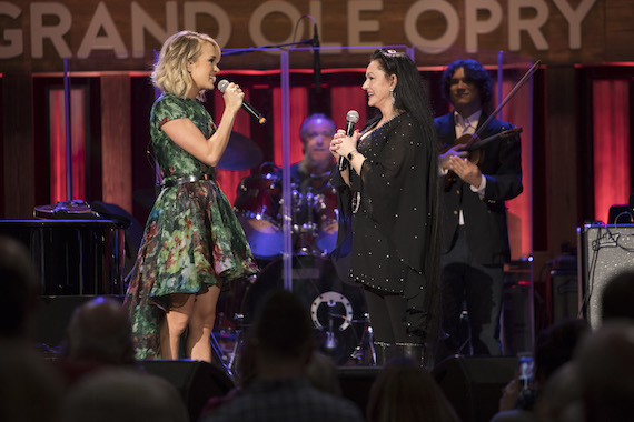 Carrie Underwood invites Crystal Gayle to join the Grand Ole Opry. Photo: Chris Hollo/Grand Ole Opry