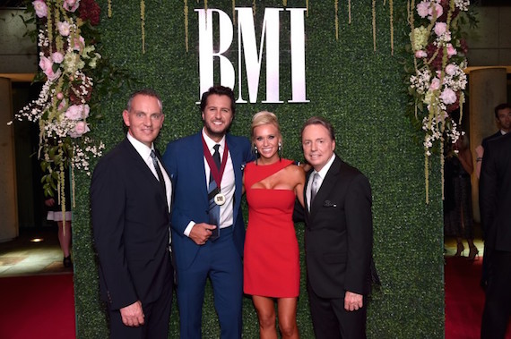 Pictured (L-R): President and CEO of BMI Michael ONeill, singer-songwriter Luke Bryan, Caroline Boyer, and Vice President, Writer/Publisher Relations at BMI Jody Williams. Photo: John Shearer/Getty Images for BMI