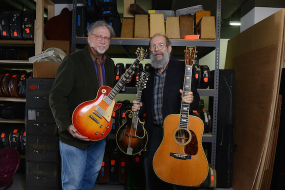 Doug Howard hold a 1923 Gibson F-5 Lloyd Loar mandolin, 1960 Les Paul Standard "Burst" electric guitar and 1939 Martin D-45 acoustic guitar that have been donated to Belmont University at Gruhn Guitars in Nashville, Tenn. November 8, 2016.