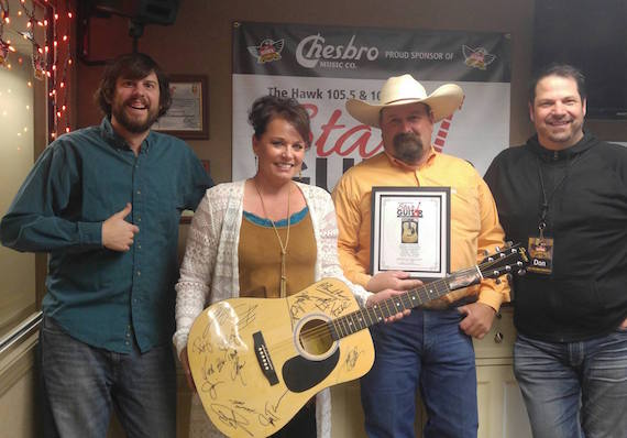 L-R: KTHK Cory Daniels, Winning Bidders Mr. & Mrs. Overdorf, KTHK Don Jarrett