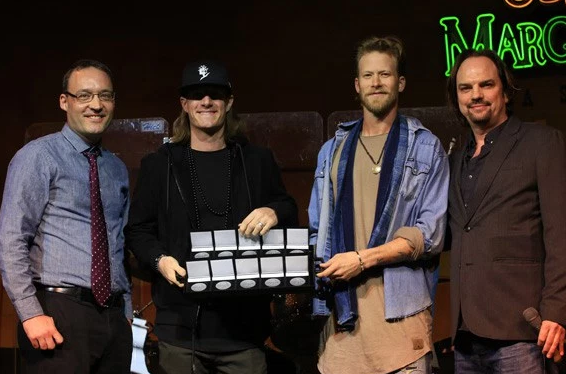 Florida Georgia Line accepts MusicRow No. 1 Challenge Coins for five chart-toppers on the CountryBreakout chart. Pictured (L-R): Craig Shelburne; Florida Georgia Lines Tyler Hubbard and Brian Kelley; MusicRows Owner/Publisher Sherod Robertson.